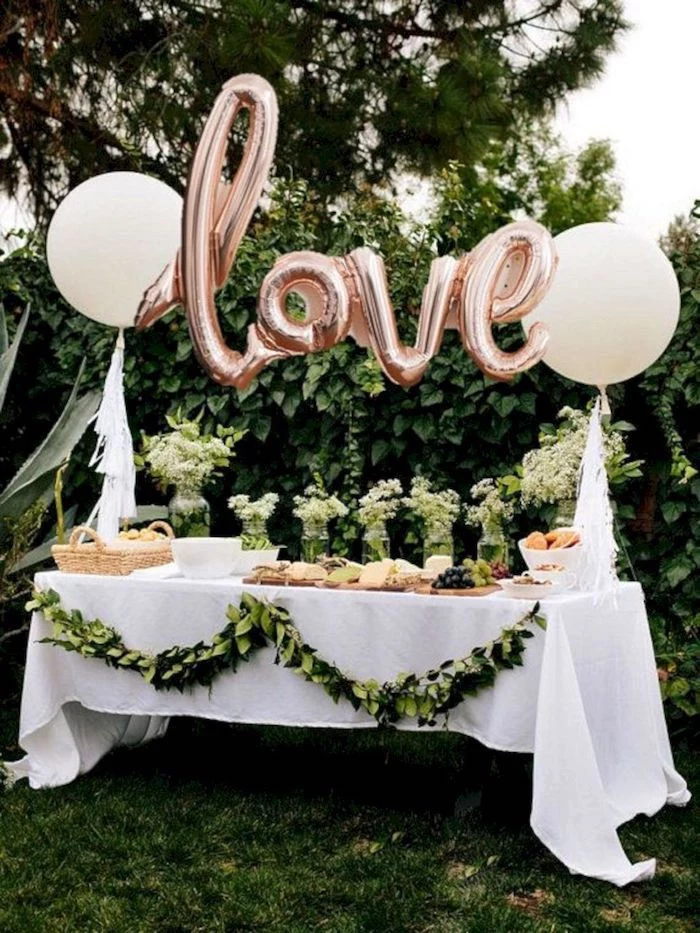 love balloons, vases with white flowers, unique bachelorette party ideas, cheese board