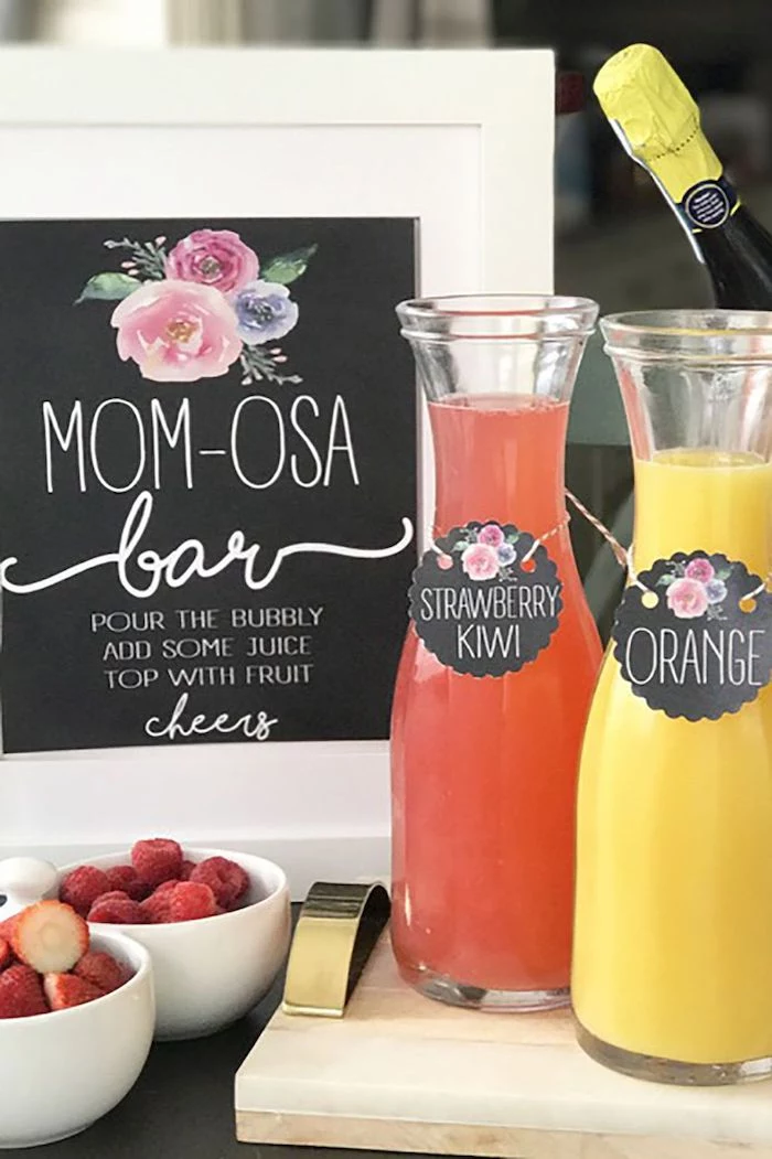 momosa bar, juice bottles, sports themed baby shower, strawberries and raspberries in bowls