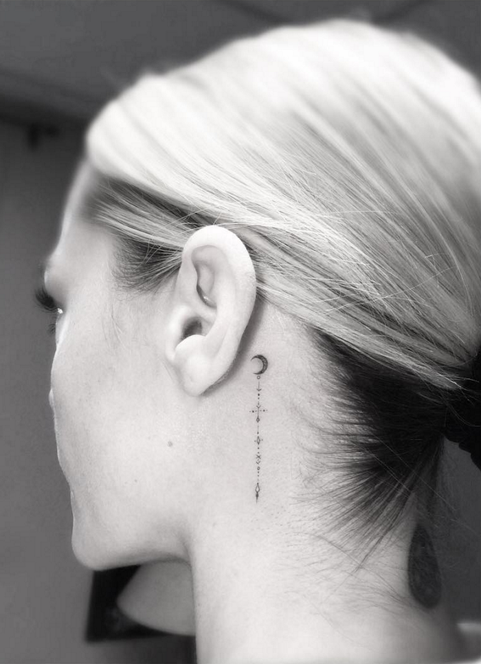 blonde hair in a ponytail, tattoo designs for women, moon tattoo behind the ear