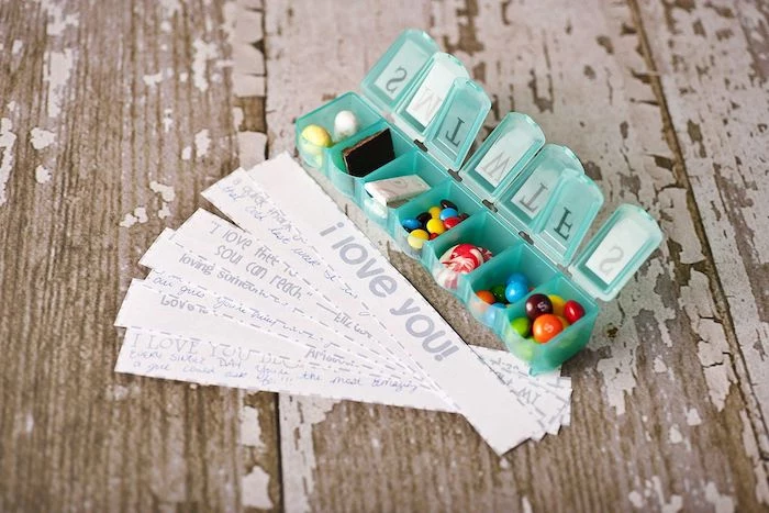 candy filled pill box, messages written on a piece of paper, creative valentine's day gifts for boyfriend