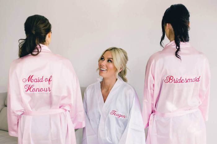 maid of honour and bridesmaid pink satin robes, white satin robe, bachelorette party themes