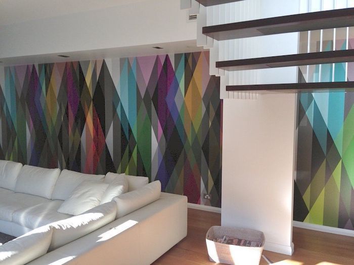 rainbow wallpaper, white corner sofa, wooden staircase, accent wall ideas bedroom