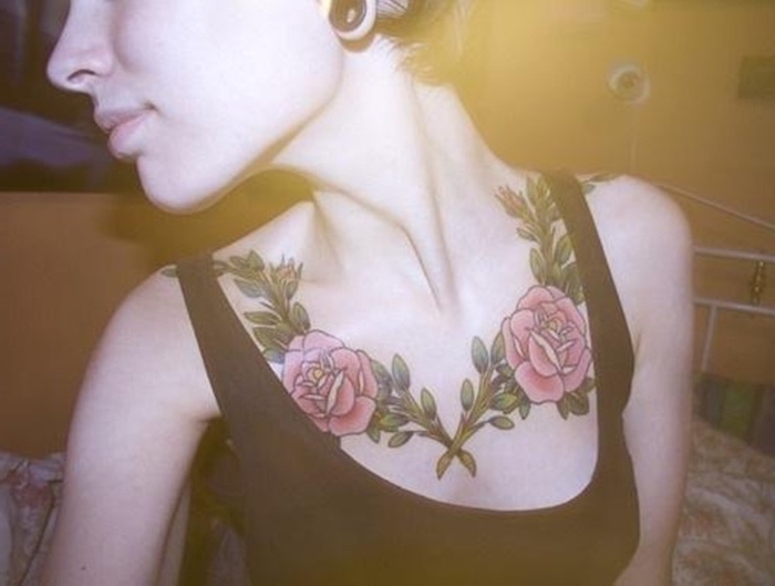 black top, two rose branches on each shoulder, red roses, tattoos for girls with meaning, tattoo designs on chest for females