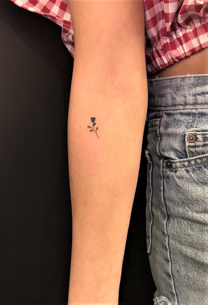 rose tattoo on the forearm, unique tattoos, plaid shirt, black background
