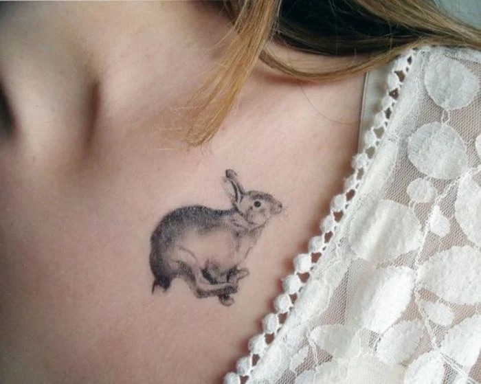 small running rabbit, tattoo on the shoulder, white top and straps, tattoos for girls on hand