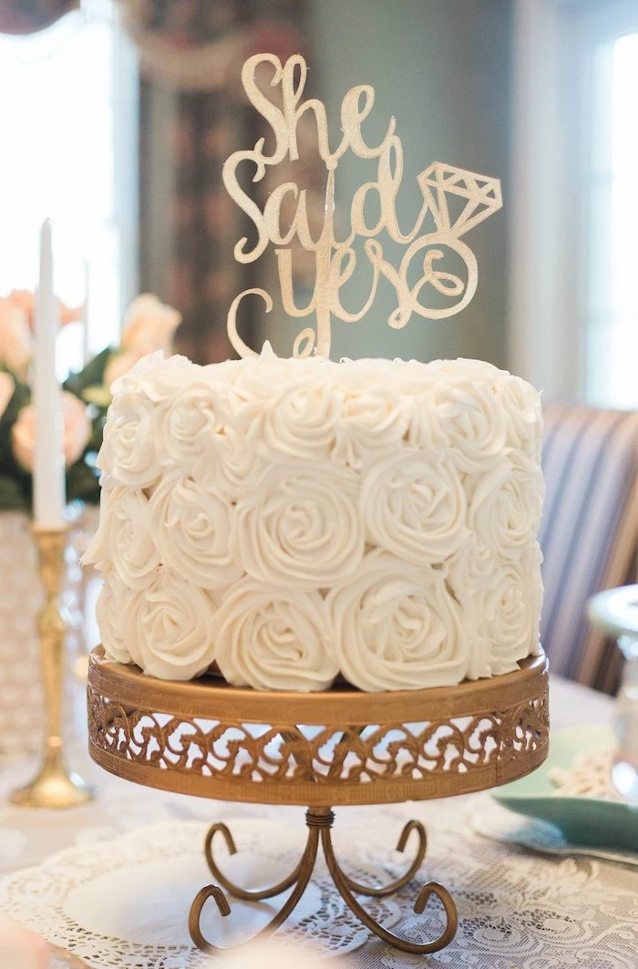 she said yes cake topper, white roses cake, golden cake stand, bachelorette shirt ideas