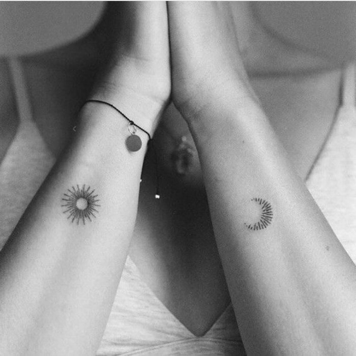 sun and moon tattoo on both arms, white top, tattoos for girls on wrist