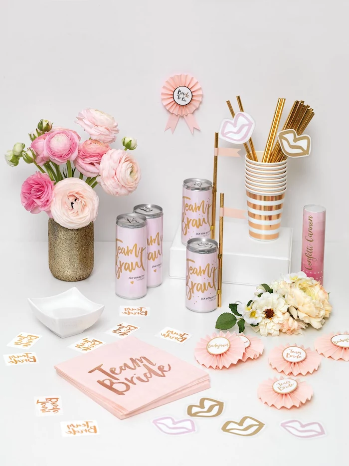 team bride napkins and cans, unique bachelorette party ideas, golden straws and paper cups, glitter vase with roses
