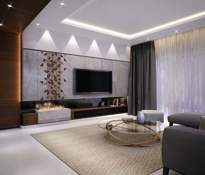 marble tiles and geometrical brown tiles on the wall, dark grey sofa, blue accent wall