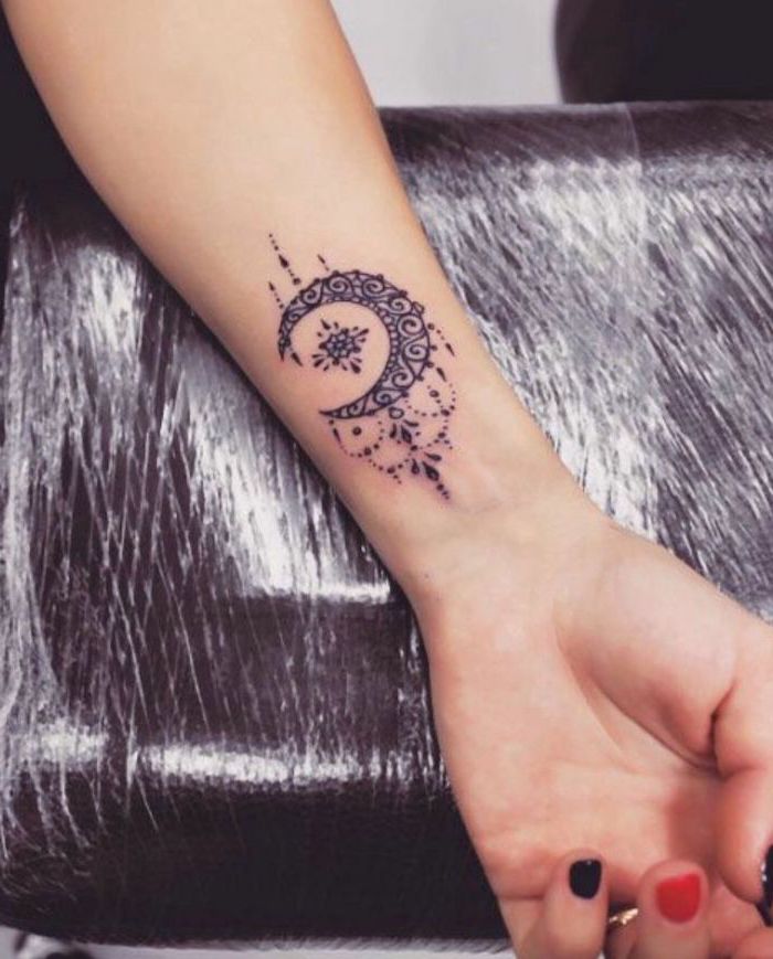 moon tattoo on the wrist, red and black nail polish, female tattoos gallery