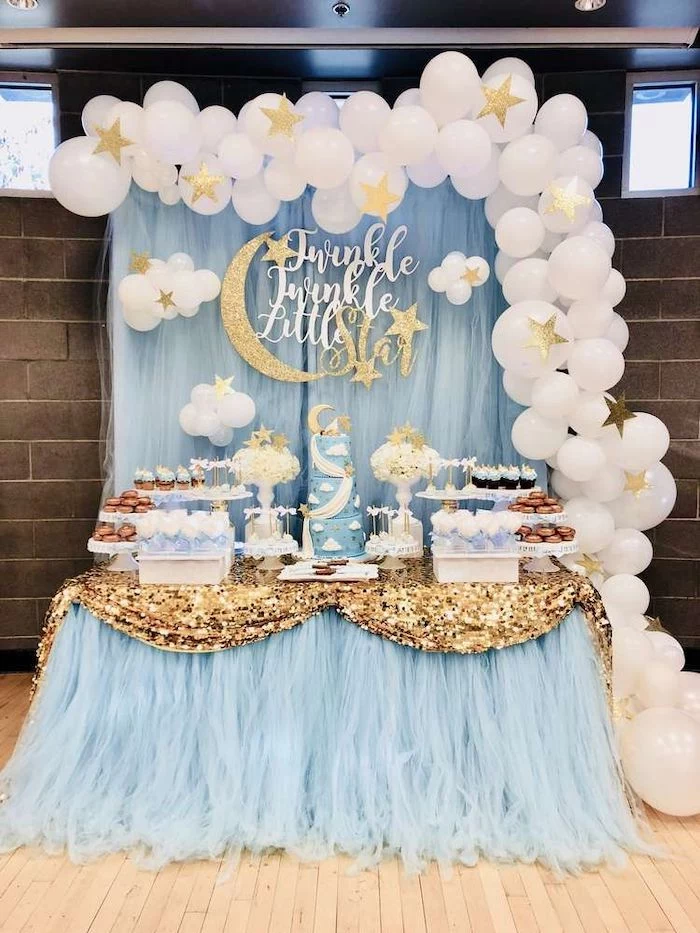 twinkle little star, white balloons and gold stars, blue tulle, cake and sweets on the table, baby boy baby shower themes