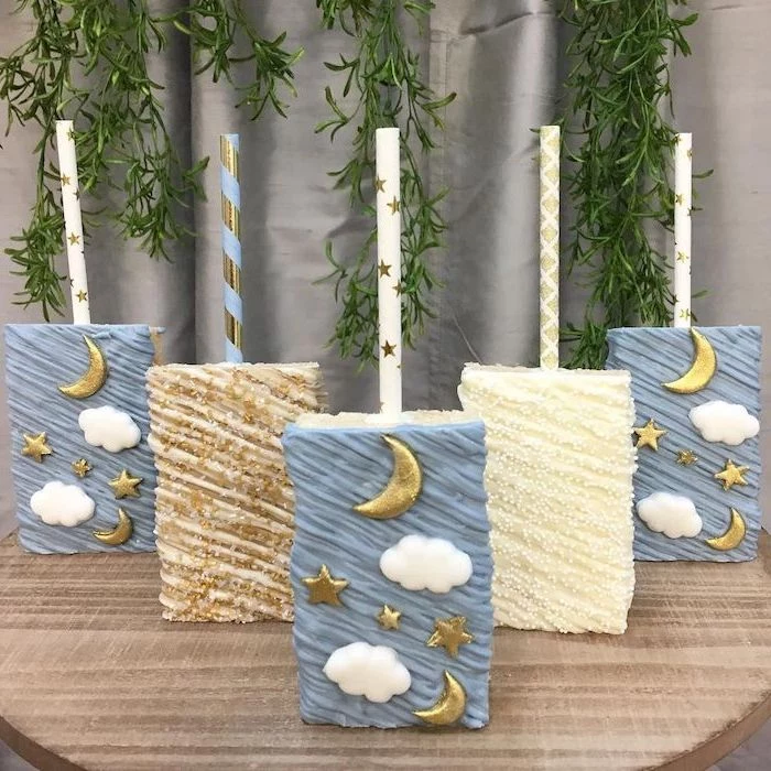 white brown and blue cake pops, gold stars and moon, sports themed baby shower, white clouds