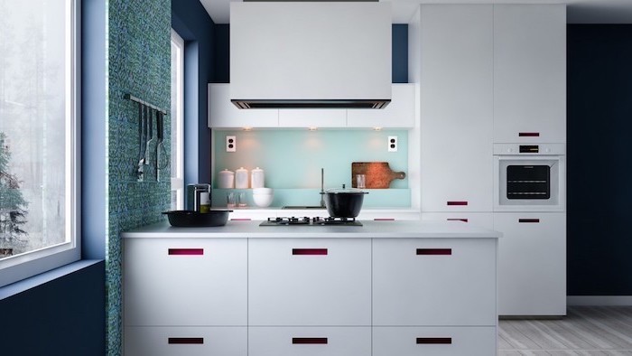 turquoise backsplash, navy blue walls, white cabinets and drawers, wooden floor, kitchen cabinets pictures