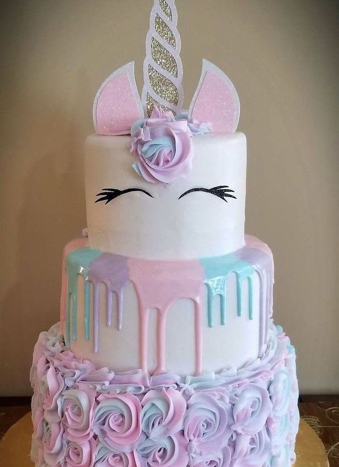 pink and silver horn and ears, pink blue and purple roses on white fondant, easy unicorn cake