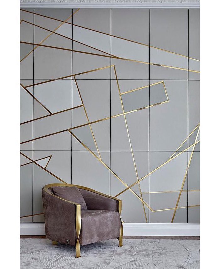 grey and gold geometrical tiles, grey velvet armchair, dining room pictures for walls