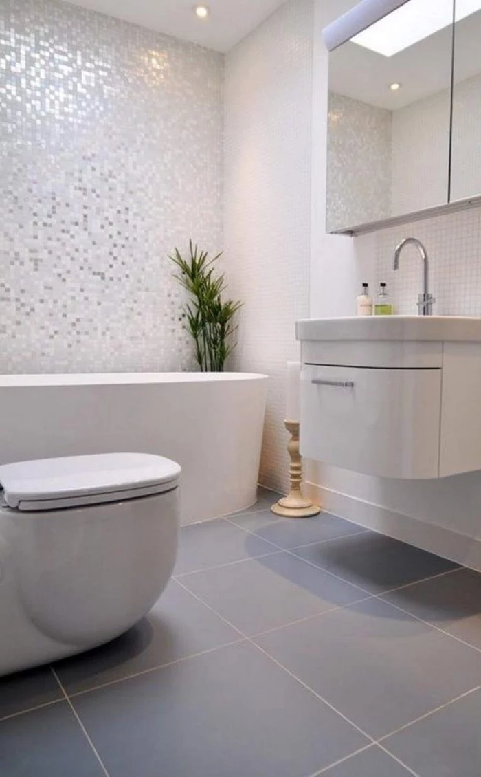 white mosaic tiled wall, blue tiled floor, bathroom ideas for small bathrooms, floating white cabinet and sink