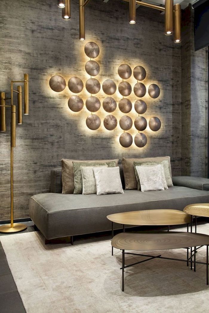 grey and golden lights 3d wall installation, wallpaper accent wall, grey sofa, metal coffee table