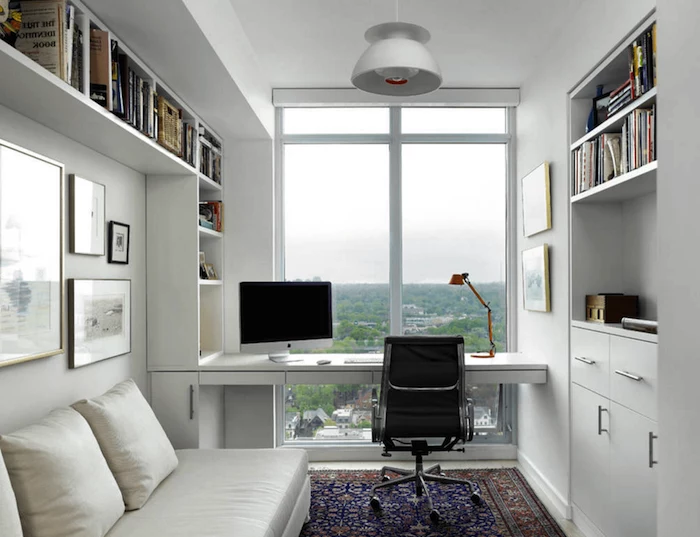 white walls and bookshelves, black leather chair, white leather sofa, office pictures, printed rug