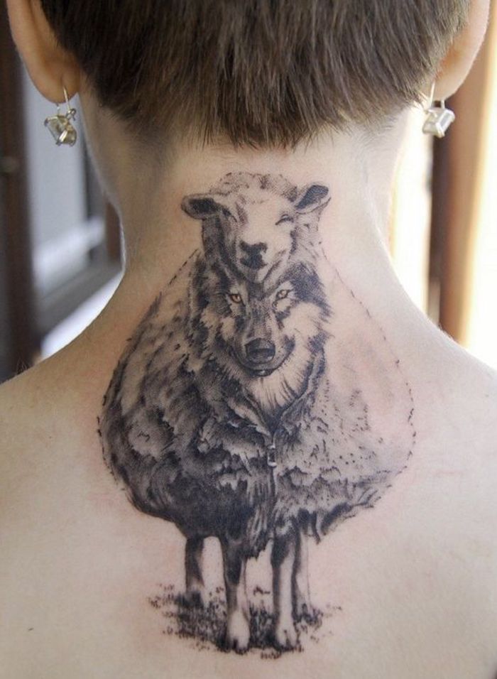 small tattoo ideas for men, wolf in sheep's clothing, back tattoo, short hair, blurred background