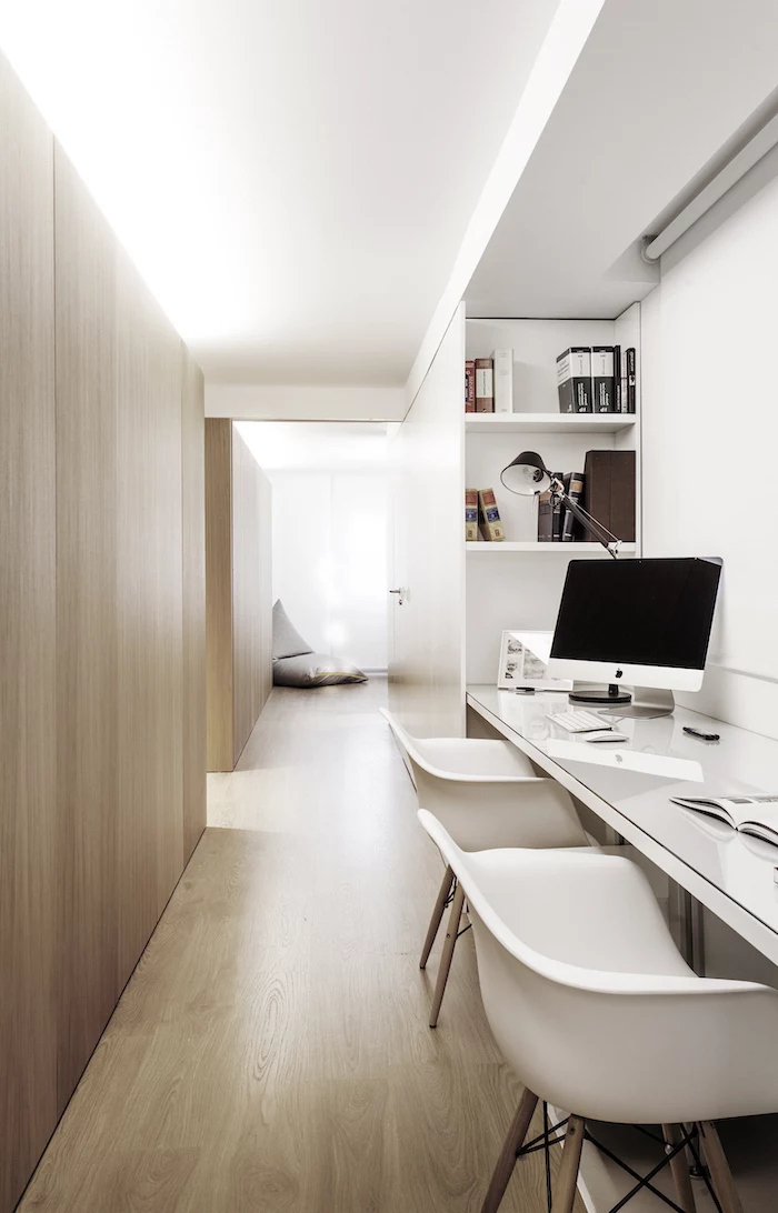 white and wooden walls, two white chairs, white bookshelves, office design, desktop computer