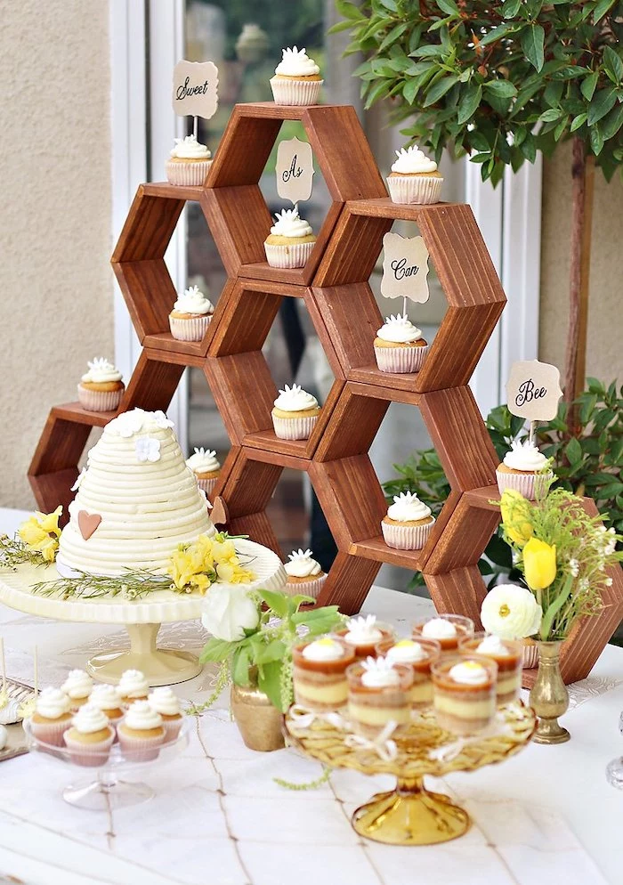 sweet as can bee cupcakes, honeycomb wooden crates, baby shower ideas for boys, cake and cupcakes on the table