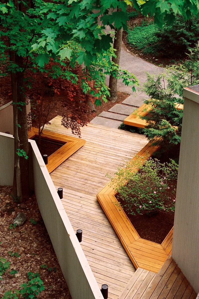 wooden pathway, landscaping ideas for front of house, wooden patches of bushes and tall trees
