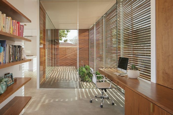wooden bookshelves and desk, white leather chair, business office decorating ideas, wooden blinds