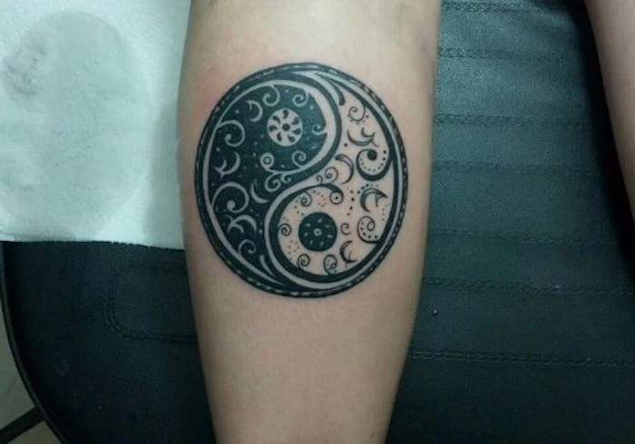 yin yang forearm tattoo, small tattoo ideas for men, black leather background