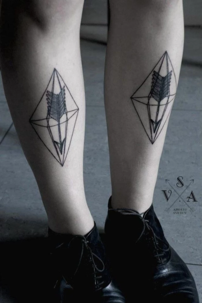 set of feet, flower of life tattoo, triangle and arrow tattoo, on both feet, wearing black shoes