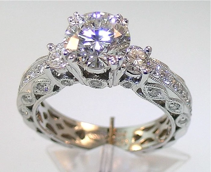 gold engagement rings, large round stone, diamond studded band, white background