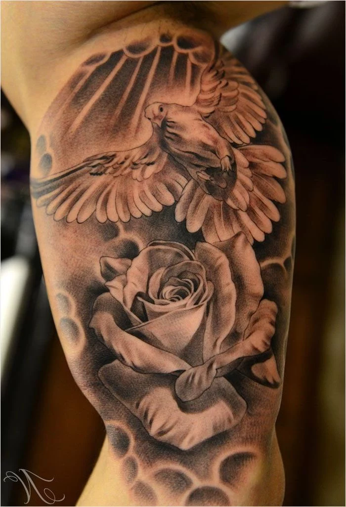flying bird and rose, forearm tattoos for men, inner arm tattoo, blurred background