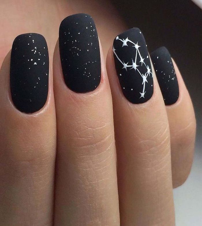 black matte nail polish, white strs drawn on nails, squoval shape nails, nail designs