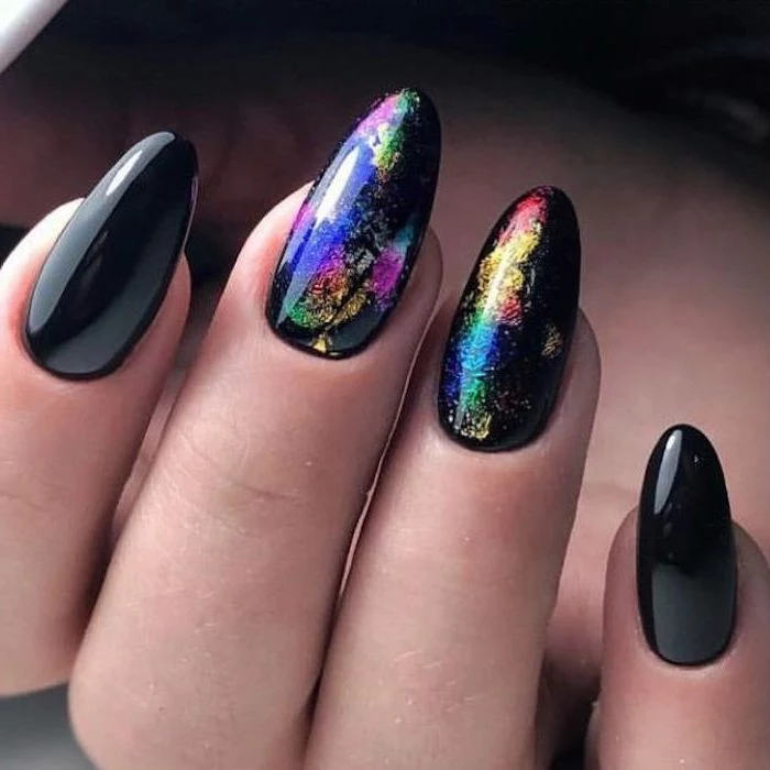 black nail polish, nail art designs, rainbow coloured, galaxy like drawings on two nails
