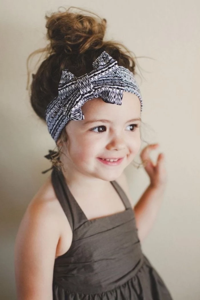 black and white bow bandana, brown hair in a messy bun, easy braid hairstyles, grey background