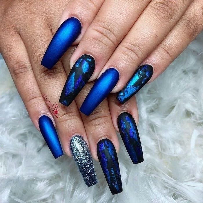 blue nail polish, nail art designs, silver glitter nail polish, black and blue marble like drawings
