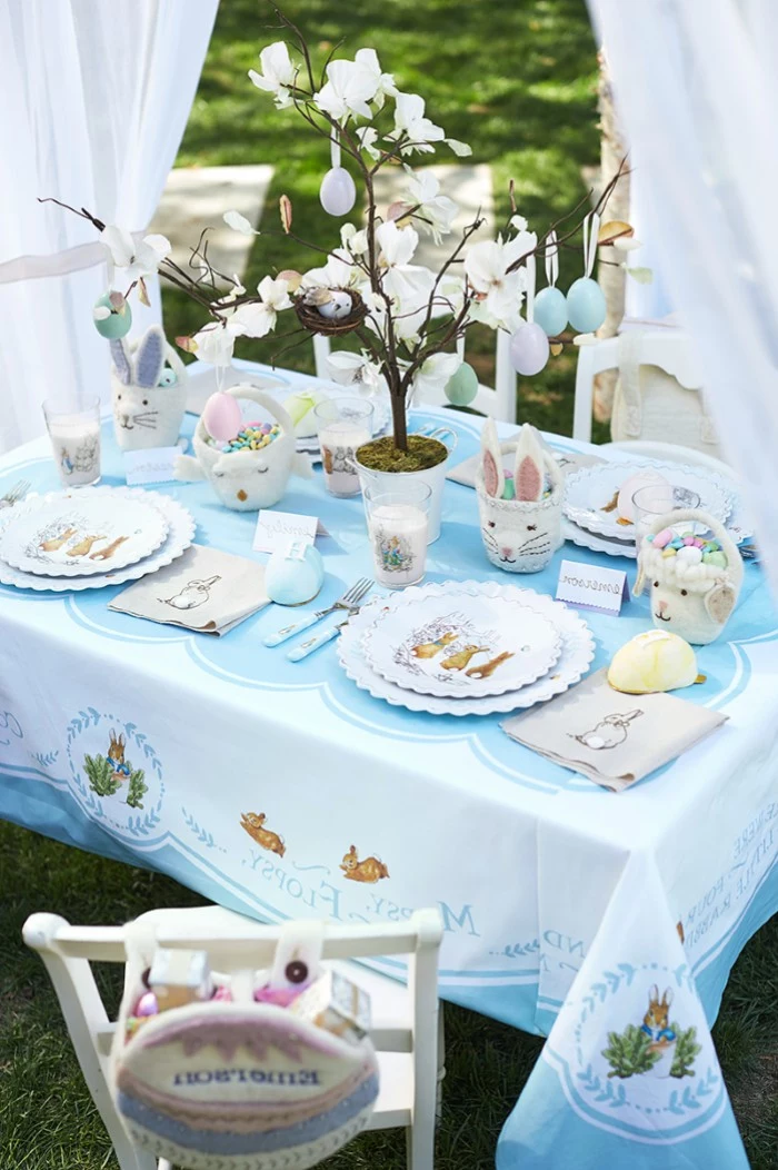 ceramic bunny figurines, easter table decorations centerpieces, white plates, kids table setting
