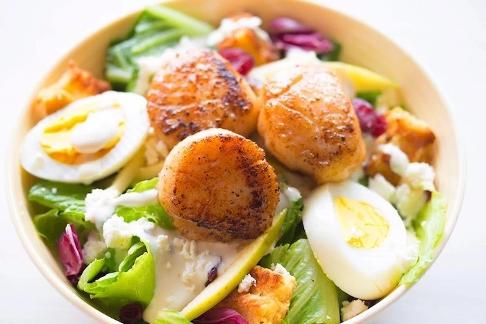 white plate, healthy weekly meal plan, full of green salad, boiled egg and meat, white background