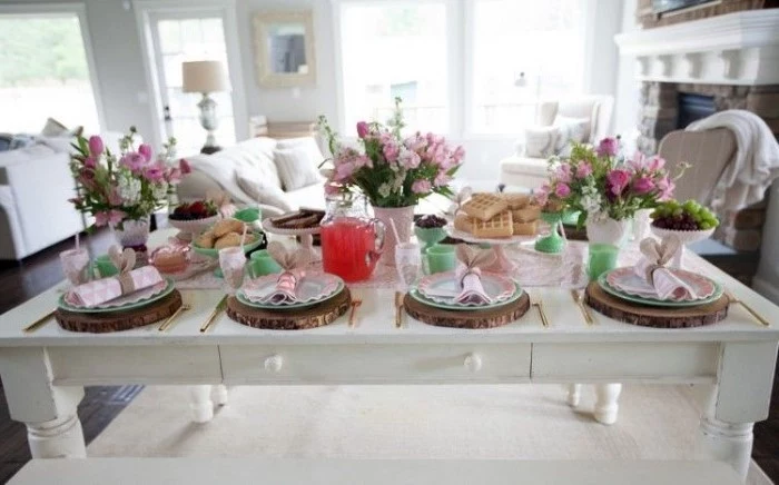 flower bouqets, pink bunny napkins, easter home decor, cake stands, with sweets on them