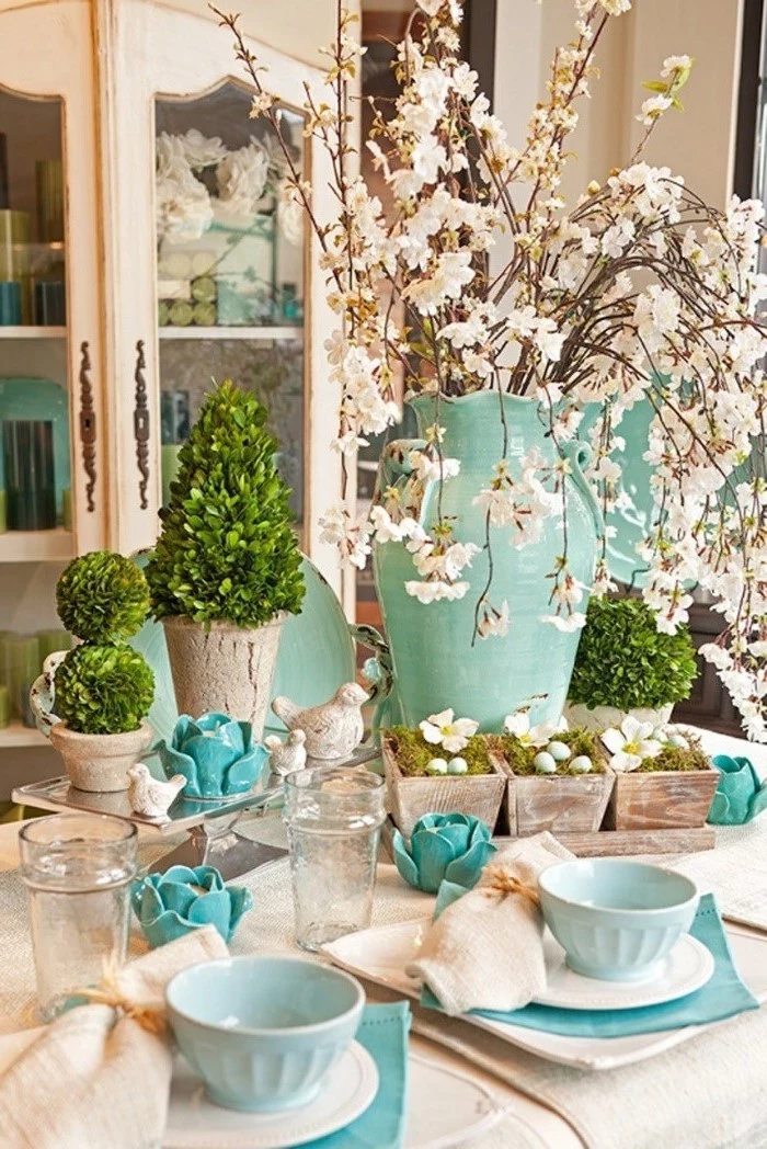 easter home decor, large blue vase, ceramic pots, blue bowls, on a white plate