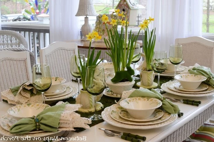 tall wine glasses, white and green plate settings, bouquets of flowers, easter home decor