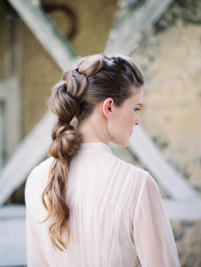 white see through top, long brown hair in a balloon ponytail, wedding hairstyles updo