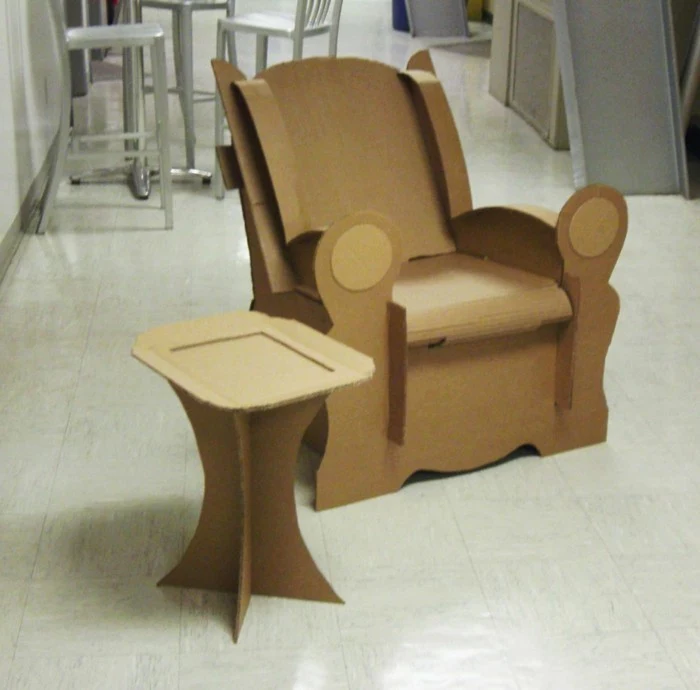 white tiled floor, cardboard dresser, cardboard armchair, cardboard side coffee table