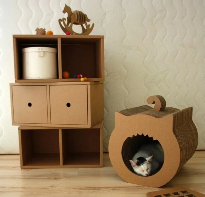 cardboard drawers and shelves, cardboard table, cardboard kitty box, wooden floor, white wall
