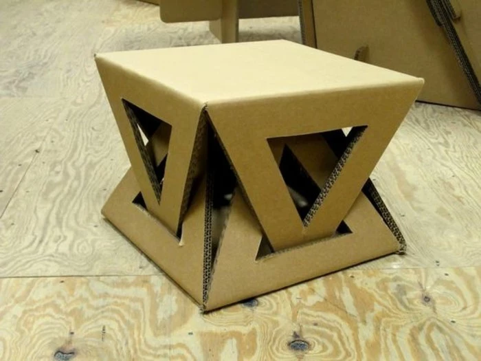 cardboard stool, intricate design, cardboard table, on a wooden floor