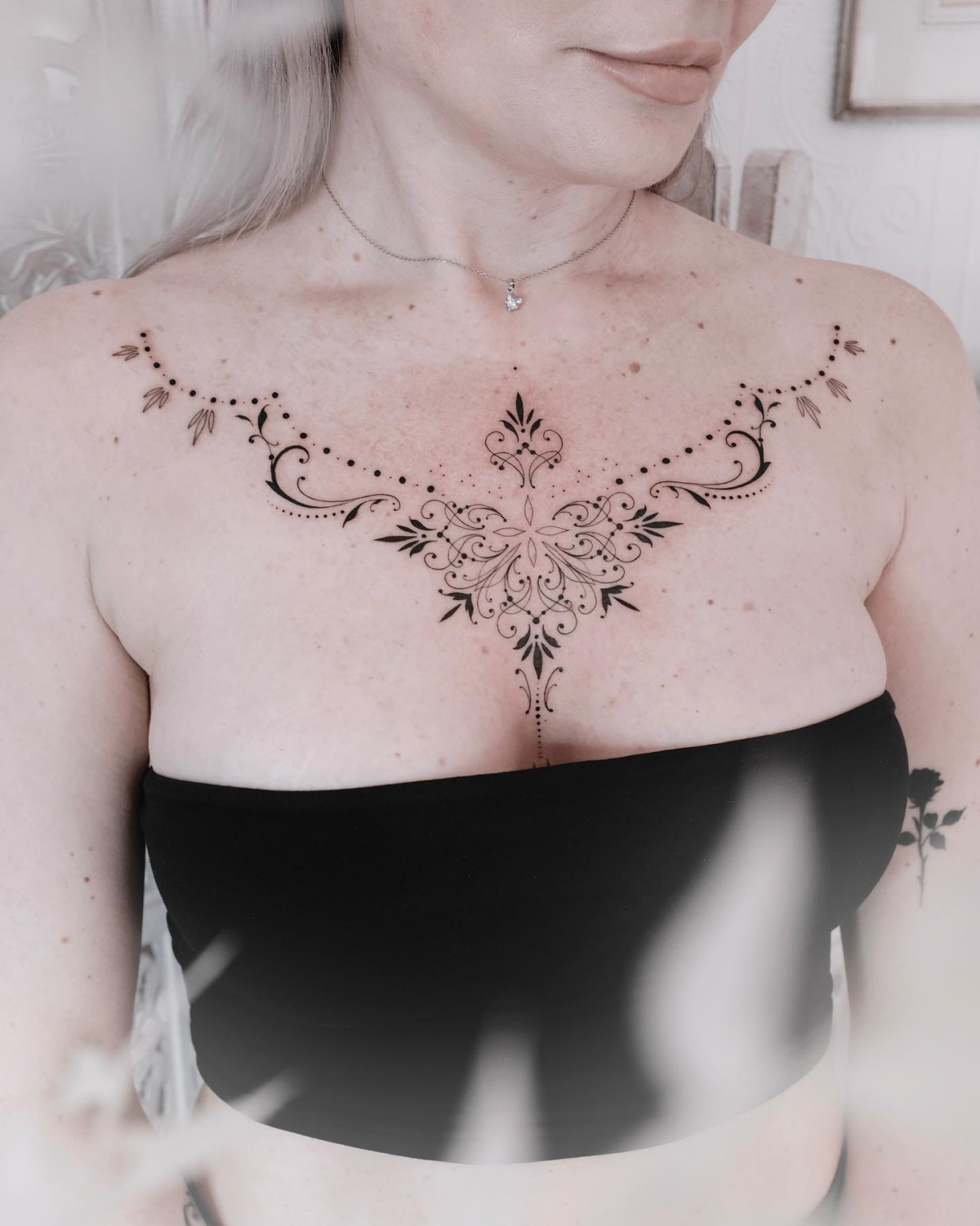 chest ornamental tattoo fine line