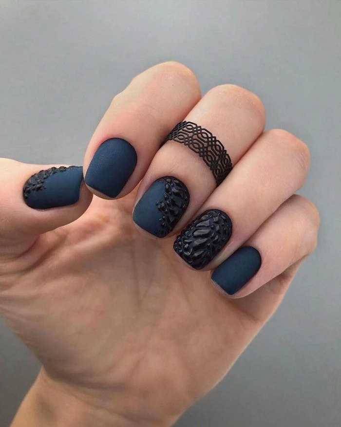dark blue matte nail polish, d3 manicure design, squoval nails, pink nail designs, black ring on the middle finger
