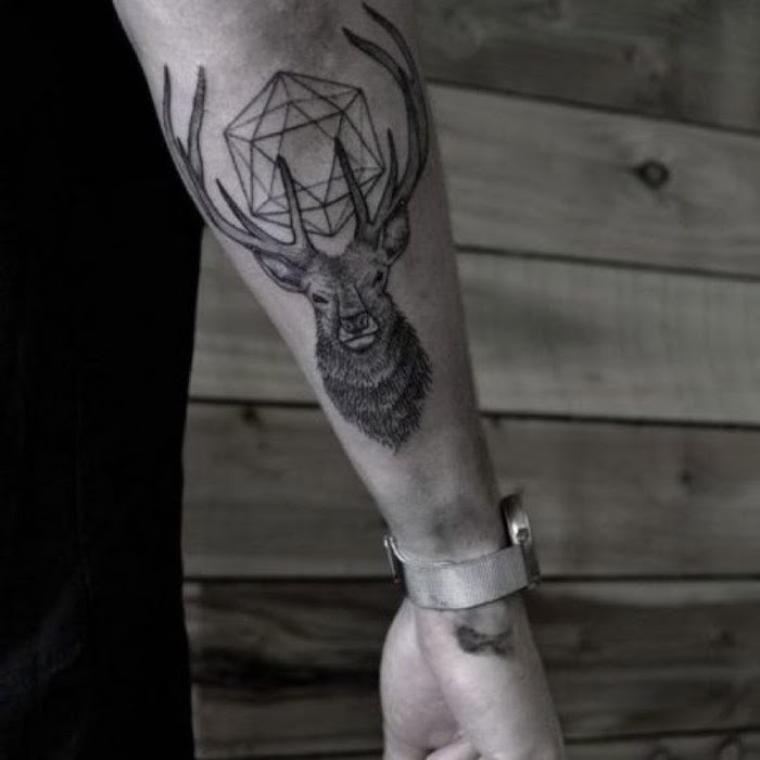 large deer, forearm tattoos, shoulder tattoos for men, silver watch, wooden background, black shirt