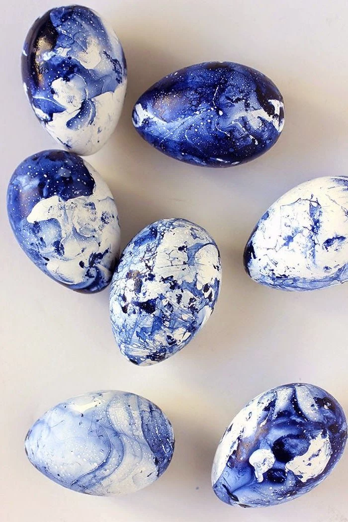 blue marble eggs, diy tutorial, dyed eggs, on a white countertop, easter egg ideas