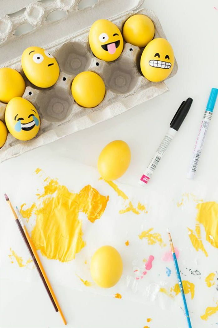 yellow eggs, with faces drawn on them, in an egg carton, yellow paint, how to dye eggs with food coloring