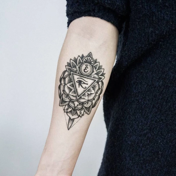 black fluffy sweater, white background, forearm tattoo, inspired by egyptian gods, flower of life tattoo
